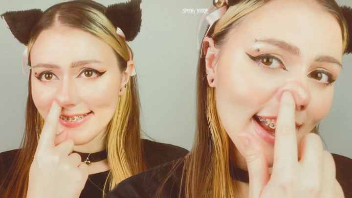 E-girl in braces is pinching her cute nose in front of you