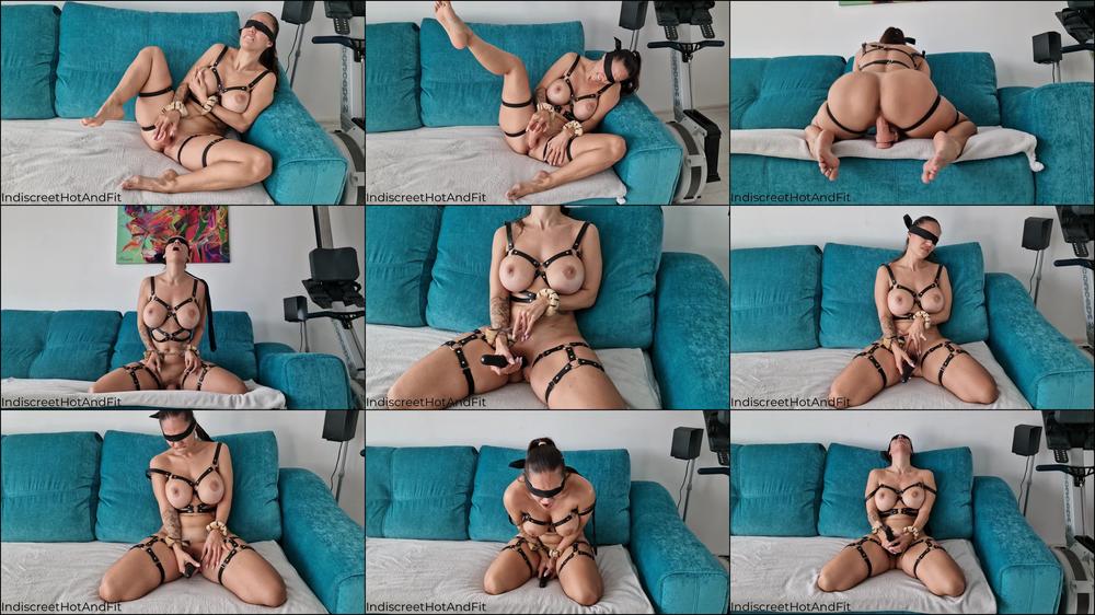 Blindfolded cuffed cougar in body harness cums hard